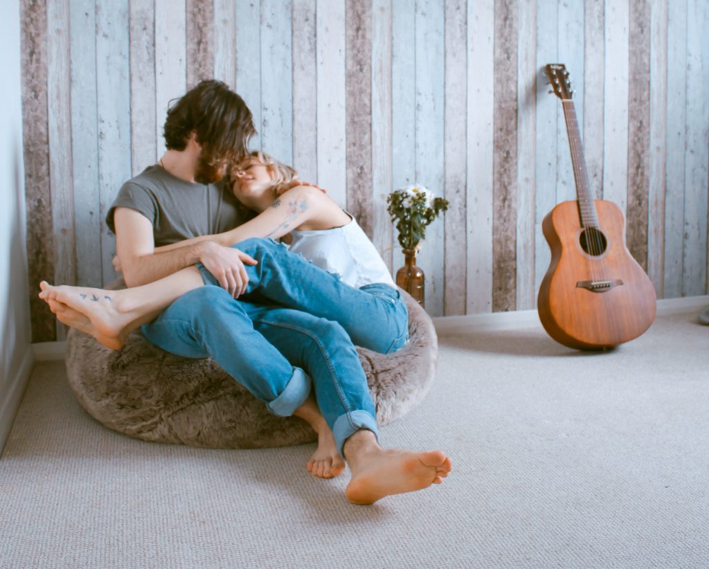 couple cuddling on bean bag